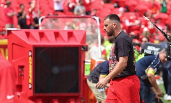 Travis Kelce sported a warmup t-shirt with photos of Rice, along with the phrase “Free 4.”(Marleah Campbell)